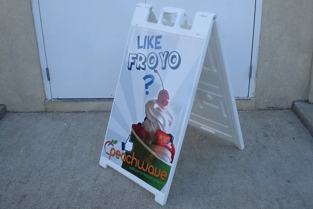 A-frame sidewalk sign helping foot traffic find an Austin, TX storefront